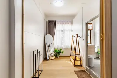 a room with a hallway with a mirror at Cozy 5-story house, 2 mins walk BTS, BKK in Bangkok