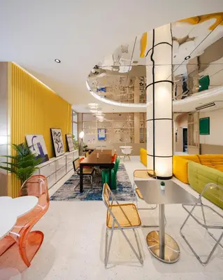 a lobby with chairs and a table and a couch at Bembis Hotel Charoenakorn 10 in Chinatown
