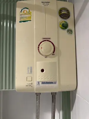 a white telephone is hanging on a wall at New Apt, Near Siam Paragon, 2 Min to BTS 1BR,4Pax in Bangkok