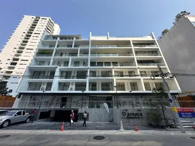 a large white building with people standing in front of it at 6th Avenue Sukhumvit BKK 409 BTS Asoke Nana MRT Sukhumvit in Bangkok