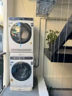 a washing machine and a washer in a trailer at Scandi Haus near ChinaTown in Bangkok