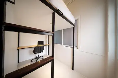 a room with a desk and a chair in it at OH Suites 72 in Bangkok