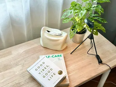a table with a thermometer and a book on it at Walk2BTS, KingBed, FastWiFi, FreeLaundry, Netflix in Khlong Toei