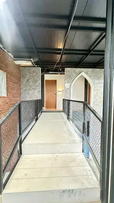 a walkway leading to a door on a building at Villa Moon Terrace in Bang Khen