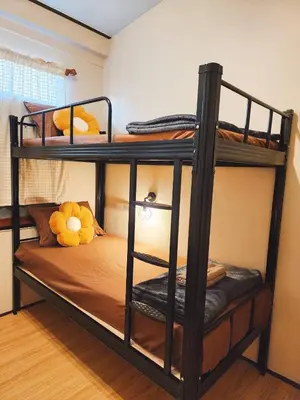 two bunk beds with a teddy bear sitting on top at 215-Olan Place Free Wi-Fi and Near BTS line in Sathani Bang Khen
