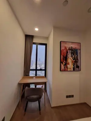 a room with a table and a chair and a window at Ashton Mrt At Bts-Silom Near samyan mitrtown in Bangkok