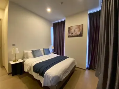 a bedroom with a bed and a window at origin phayathai 28 in Bangkok
