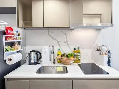 a kitchen with a sink and a counter top at New City Condo in Central Bangkok Siam Paragon Central World in Pratunam