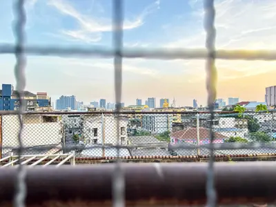 a view of a city skyline from a building at Nortas Tha Phra in Bangkok