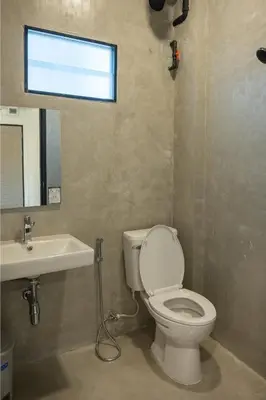 a bathroom with a toilet and a sink at Morning Place in Ban Krathum Lom