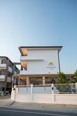 a white building with a fence in front of it at Morning Place in Ban Krathum Lom