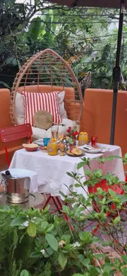 a table with plates of food on top at Dar Wafa Riad, Restaurant and Hamam in Bangkok