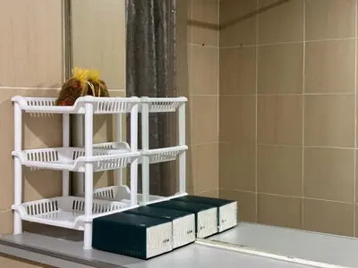 a stack of white baskets sitting on a table in front of a mirror at Bann-Kun Impact Muang Thong 2BR Condo Wi-Fi MRT Pink Near Airport DM