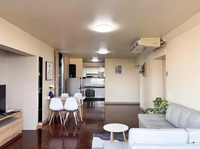a living room with a white couch and white chairs at Bann-Kun Impact Muang Thong 2BR Condo Wi-Fi MRT Pink Near Airport DM