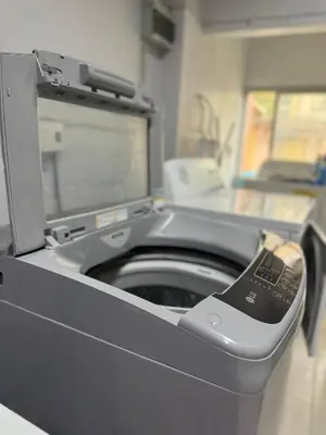 a washing machine with its door open in a room at Thonglor BTS 1-Min Walk Easy Check-In Laundromat in Khlong Toei