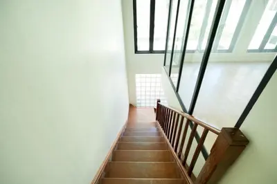 a staircase in a building with windows at XX Snap Sukhumvit 1 -BTS Nana Bangkok in Makkasan