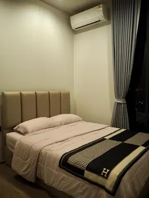 a bedroom with a bed with a air conditioner at The Crest Park Residences Monthly Rent only #2BR Apartment at Chatuchak #MrtBts in Bangkok