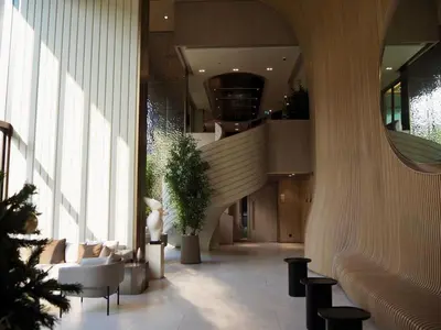 a lobby with a spiral staircase in a building at The Crest Park Residences Monthly Rent only #2BR Apartment at Chatuchak #MrtBts in Bangkok