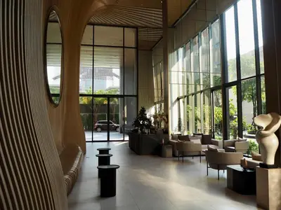 a lobby of a building with a lot of windows at The Crest Park Residences Monthly Rent only #2BR Apartment at Chatuchak #MrtBts in Bangkok