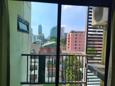 a view of a city from a balcony at mint apartment in Sathani Bang Su