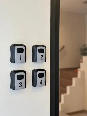 a set of switches on a wall with stairs at Common Living Bangkok in Bangkok