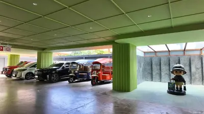 a group of cars parked in a parking lot at Leston Hotel in Bangkok