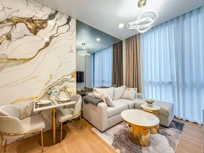 a living room with a couch and a table at Luxury Residence in Central of Bangkok Siam Paragon Central World in Pratunam