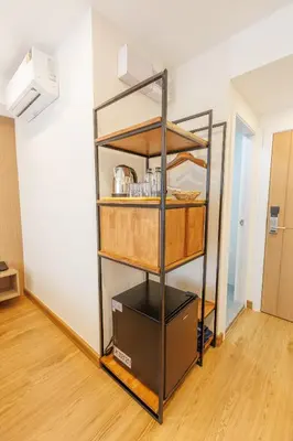 a shelf in a room with some food on it at Believeinn in Bangkok