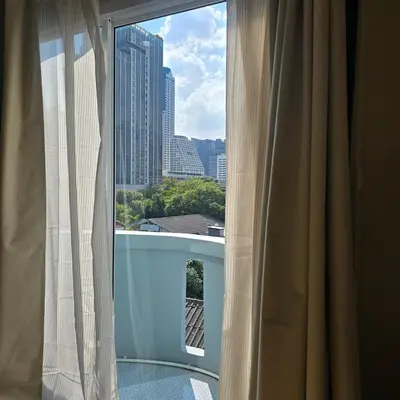 a window with a view of a city skyline at Bangkok Duplex Silom No 6 in Bangkok