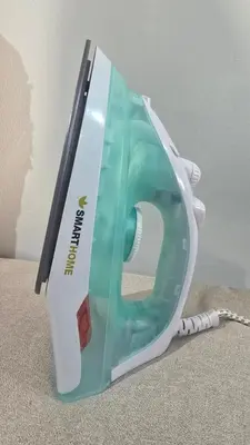 a green and white appliance sitting on the floor at Bangkok Duplex Silom No 6 in Bangkok