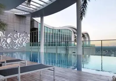 a view of a building with a swimming pool at The Onnut Nest 1BR Sofa Bed Onnut BTS 50m in Bangkok