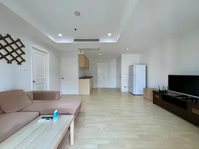 a living room with a couch and a television at City Living condo at BKK in Bangkok