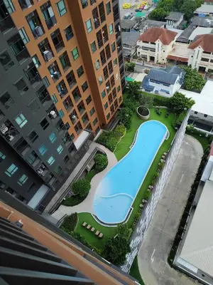 an overhead view of a swimming pool in a city at Apartment in Thon Buri 0 meter From BTS station in Bang Khun Thian