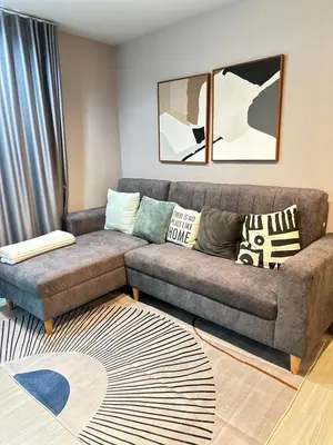 a living room with a couch and a rug at 2 Bed 2 Bath Condo Steps to BTS&MRT in Bangkok