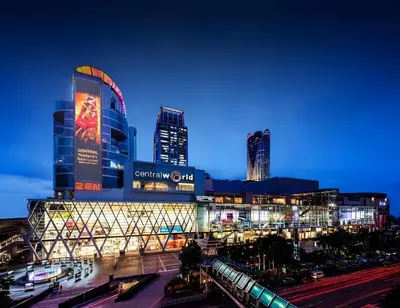 a large building with a train station at night at xx Wish Inn Chidlom - Ratchadamri 2 in Pratunam