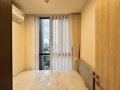 a bedroom with a large window with a view of a city at Spacious 2 Bedrooms at MRT Rama 9 and Central R9 in Bangkok