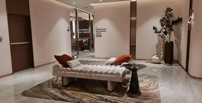 a living room with a couch and a table at New Ultra Highend Condo center BKK BTS 4min walk Perfect for Staycation in Bangkok