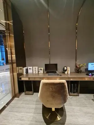 an office with a desk with a computer and a chair at New Ultra Highend Condo center BKK BTS 4min walk Perfect for Staycation in Bangkok