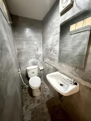a bathroom with a toilet and a sink at xx zNap Khaosan - แสนป ข้าวสาร รามบุตรี in Bang Bua Thong Railway Station