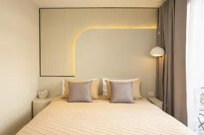 a bedroom with a large bed with two pillows at 2 Bedrooms 4 guests Private Floor at Sathorn in Bangkok
