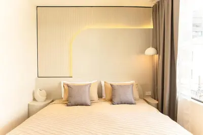a bedroom with a bed with two pillows at 2 Bedroom for 4 Guests Private at Center Sathorn in Bangkok