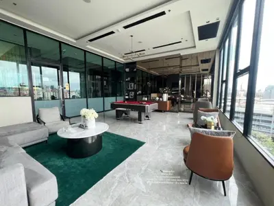 a living room with a pool table in a building at New Luxury Condo 5 Min Onnut BTS - Modiz Sukhumvit 50 in Bangkok