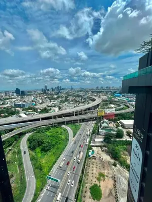 an overhead view of a highway with traffic on it at New Luxury Condo 5 Min Onnut BTS - Modiz Sukhumvit 50 in Bangkok