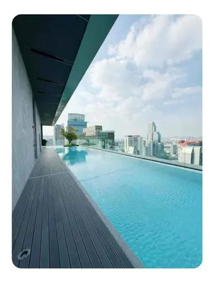 a large swimming pool on top of a building at Luxury 1 Bedroom l BTS 2 mins l Pool and Gym in Pratunam