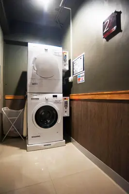 a washer and dryer in a room at Cloud 9 Lodge in Bangkok