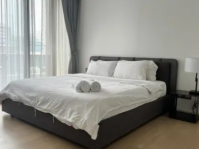 a bed with two towels on top of it at City life Nana - near Bumrungrad Hospital in Bangkok