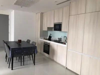 a kitchen with a black table and a kitchen with a stove at City life Nana - near Bumrungrad Hospital in Bangkok