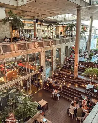 an overhead view of a restaurant with people sitting at tables at Supreme Spacious 2-Bedroom in Prime Location! BTS Thonglor in Bangkok