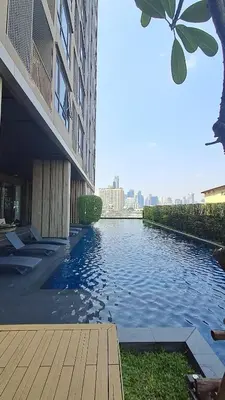 a body of water in front of a building at High Rise Designer Gem Central Bangkok City View in Bangkok