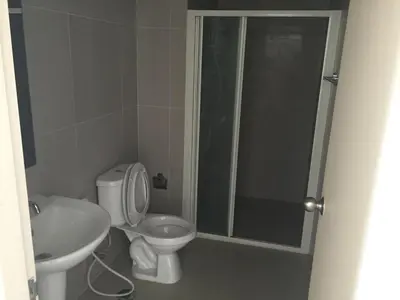 a bathroom with a toilet and a sink and a shower at SS Sukhumwit in Amphoe Phra Khanong